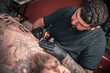 © Mr. Prof - Tattoo artist demonstrates the process of getting tattoo tattoo studio