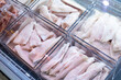 Fresh frozen fish in the refrigerator in the supermarket