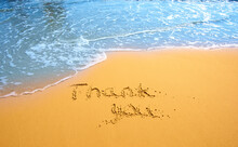 Concept Or Conceptual Hand Drawn Thank You Text Carved In A Golden Sandy Beach