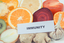 Inscription Immunity, Fresh Healthy Fruits And Vegetables Containing Vitamins. Immune Boosting In Times Of Covid-19