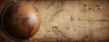 Ancient Globe On The Old Map Background. Selective Focus. Retro Style. Science, Education, Travel, Vintage Background. History And Geography Team. Blue Tinted.