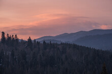 Small Alpine Village And Winter Snowy Mountains In First Sunrise Sunlight Around, Voronenko, Carpathian, Ukraine.