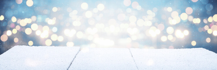 Wall Mural - Winter Christmas scenic background with wooden table and copy space.
