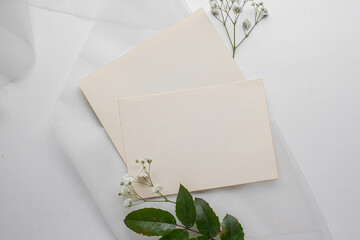 mockup card with plants. invitation card with environment Mockup with postcard 

card mockup with white flowers and envelope. wedding invitation 