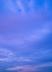 Wall Mural - Beautiful view of sky with clouds at sunrise. Partly cloudy. Colorful sunset. Natural blue sky background texture, beautiful color.