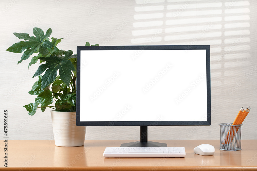 Front view of simple workspace with modern computer and office supplies ...