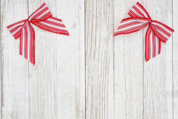 Wall Mural - Red and white candy cane bow Christmas background with weathered wood
