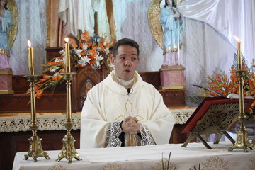 Wall Mural - Priest Celebrating Mass in Easter