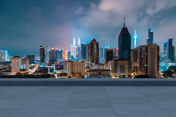 Wall Mural - Panoramic Kuala Lumpur skyline view, concrete observatory deck on rooftop, night. Asian corporate and residential lifestyle. Financial city downtown, real estate. Product display mockup empty roof