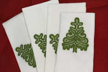 Linen Napkins With Embroidery In The Shape Of A Christmas Tree And Hemstitch Along The Edges For A Family Feast.