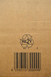 Brown and beige cardboard paper on barcodes printed recycling icon symbol