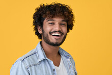 Smiling Cheerful Young Curly Indian Cool Positive Guy Laughing Isolated On Yellow Background. Happy Ethnic Stylish Man Looking At Camera Posing For Headshot Close Up Face Portrait.