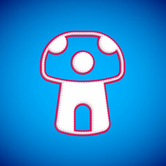 Poster - White Fantasy mushroom house icon isolated on blue background. Fairytale house. Vector