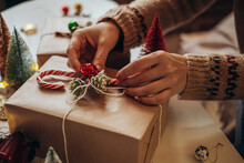 Woman S Hands Wrapping Christmas Gift Boxes, Close Up. Unprepared Presents On White Table With Decor Elements And Items Christmas Or New Year DIY Packing Concept.