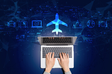 Wall Mural - Flight ticket booking concept with person using a laptop computer