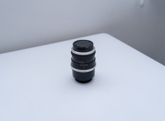 Sticker - Closeup of a camera lens on a white table