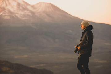 Wall Mural - person on the top of a mountain