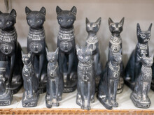 Stone Black Statuettes Of Egyptian Cats Are Sold In A Souvenir Shop. Selective Focus. Luxor, Egypt.