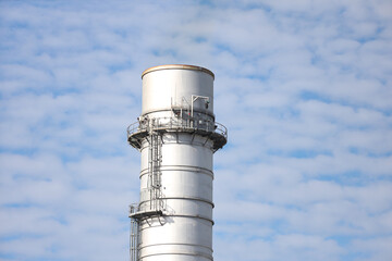 Industrial view of building and chimney.