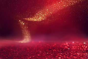 Wall Mural - background of abstract red, gold and black glitter lights. defocused