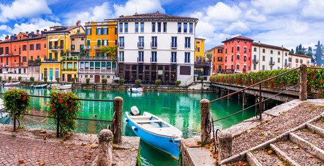 Wall Mural - Peschiera del Garda - charming village with colorful houses in beautiful lake Lago di Garda. Verona province, northern Italy