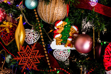 Canvas Print - Beautiful decorations and ornaments hanging on a Christmas tree with lights