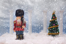 Nutcracker With Christmas Tree And Falling Snow
