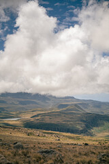 Wall Mural - vertical shot of the beautiful cloudscape above the highland in summer. natural landscape.