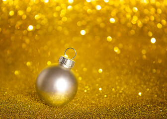 Wall Mural - christmas ornament on yellow glittering background