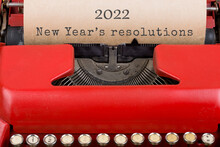 Christmas Concept - Red Typewriter With The Text "2022 New Year's Resolutions". Close Up