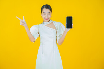 Wall Mural - Portrait beautiful young asian woman smile with smart mobile phone