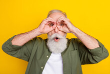 Photo Portrait Of Grandfather Looking Far In Binocular Isolated Vibrant Yellow Color Background