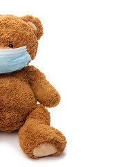 Wall Mural - medicine, healthcare and pandemic concept - teddy bear toy in protective medical mask on white background