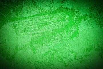 Texture of green decorative plaster or concrete with vignette.