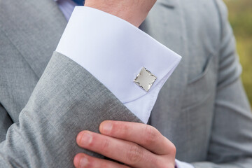 Poster - Closeup shot of an elegant cufflink on the wrist