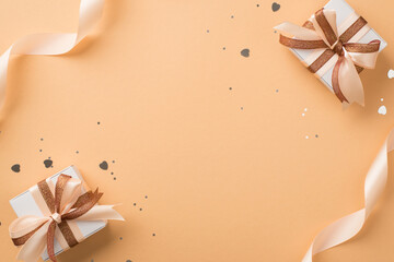 top view photo of valentine's day decorations satin ribbon white gift boxes with glowing brown and l