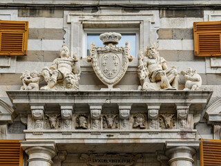 Wall Mural - Detail of the portal of Sinibaldo Fieschi Palace with sculptures and coat of arms, Genoa, Liguria, Italy