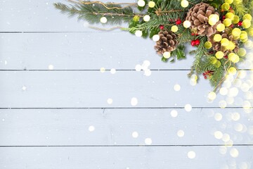 Canvas Print - Winter Christmas background with fir branches cones and snow on wooden texture