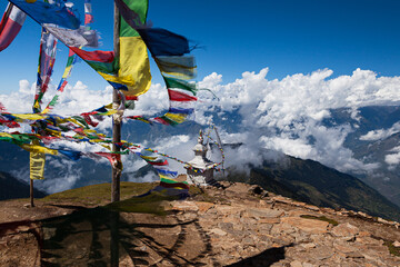 Tibetan prayer flag on the slope of the Himalayan mountains