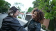 © Marco - Girlfriends embrace and hug. Two diverse women hugging outside