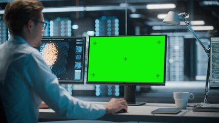 Poster - High-Tech Data Center Server: Male IT Specialist Working on Green Screen Chroma Key Computer. Monitoring Web Services, Cloud Computing, Analytics Facility, Maintenance of Cyber Security