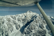 Beautiful Snow Covered Mountains Seen From Small Airplane