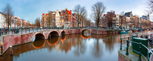 Panorama Of Amsterdam Canal Keizersgracht With Typical Dutch Houses And Bridge During Morning Blue Hour, Holland, Netherlands