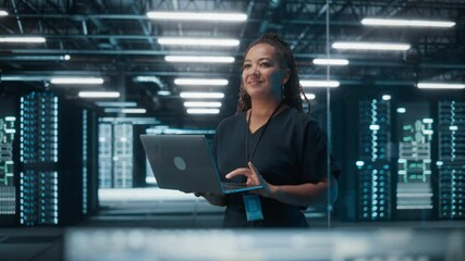 Fototapete - Portrait of Successful African American Female IT Specialist Using Laptop, Standing in Data Center. System Administrator Works on Web Services. Cloud Computing, Server Analytics, Cyber Security