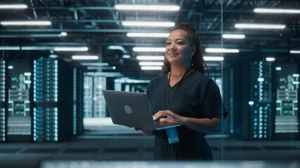Fototapete - Portrait of Successful African American Female IT Specialist Using Laptop, Standing in Data Center. System Administrator Works on Web Services. Cloud Computing, Server Analytics, Cyber Security
