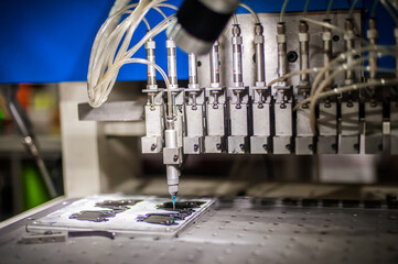 Closeup detail view of soft PVC dispensing machine head