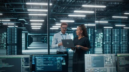 Fototapete - Data Center Black Female e-Business Enrepreneur and White Male IT Specialist talk, Use Laptop. Information Technology Engineer and System Administrator work in Big Cloud Computing Server Farm.
