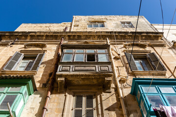 Poster - Low angle shot of a residential building facade in Valetta, Malta