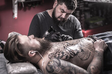 Master Tattooist Demonstrates The Process Of Getting Tattoo