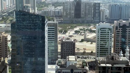 Wall Mural - Aerial high view of Abu Dhabi city (UAE) from downtown, Abu Dhabi corniche road and beach